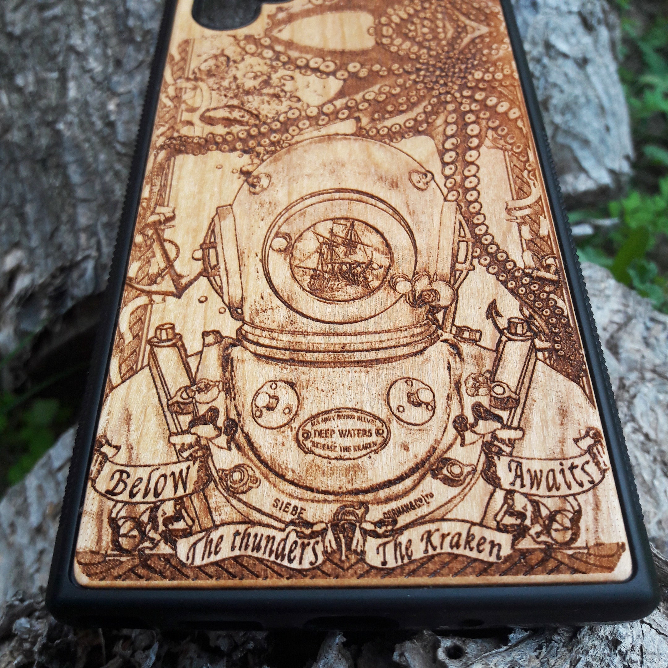 Wooden phone case featuring a detailed deep-sea diver and kraken design, laser-engraved for iPhone 16, iPhone 15, Samsung Galaxy S25, and other models. A must-have for fans of nautical and mythical art.