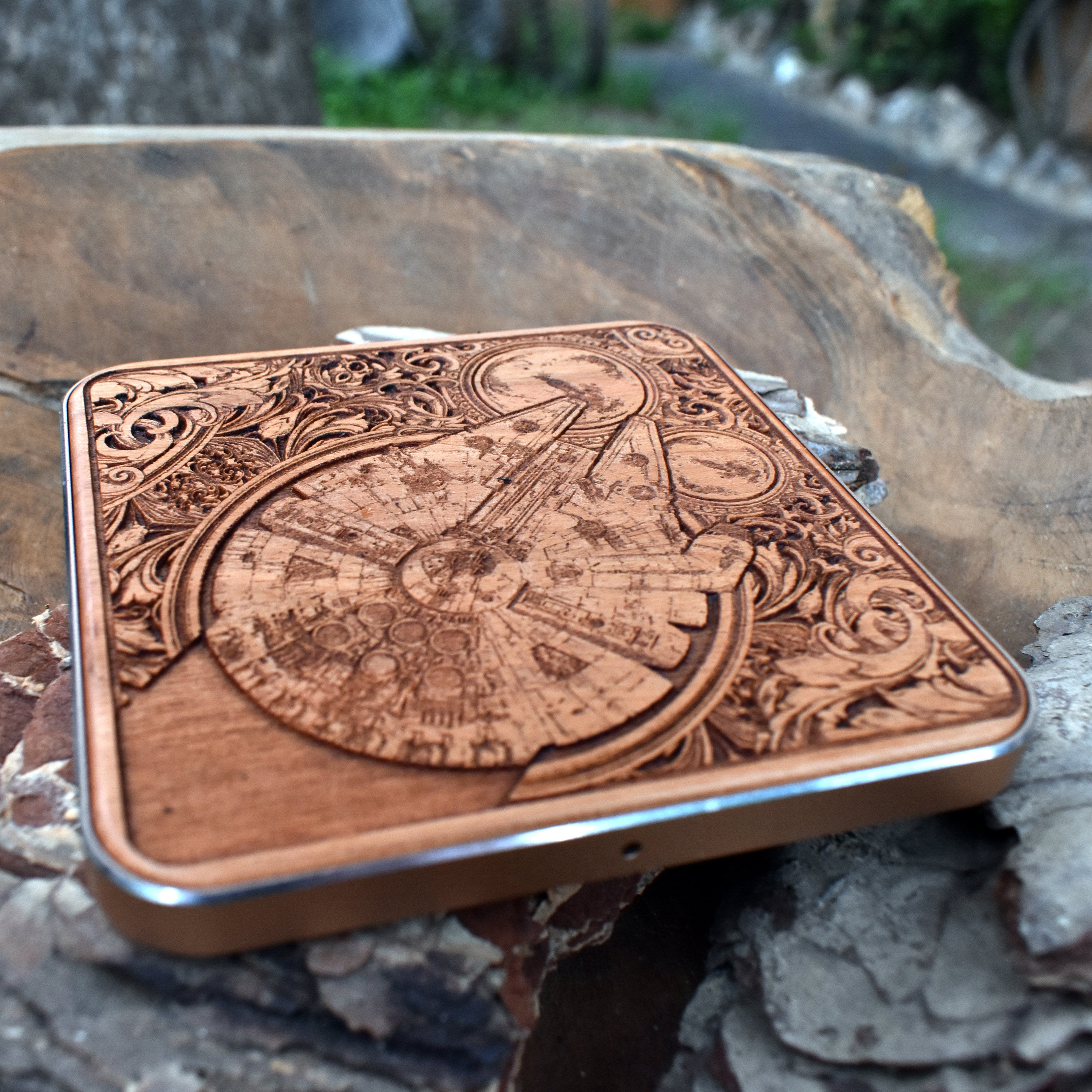 Dark wood wireless charger featuring sci-fi battle ship designs.