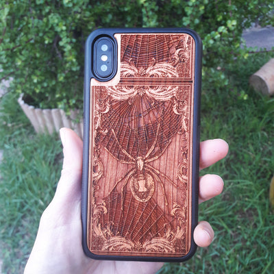 Wooden phone case featuring a detailed Black Widow Spider engraving, handcrafted for iPhone , iPhone 15, Samsung Galaxy S, and more. Perfect for horror and gothic enthusiasts looking for unique, durable phone protection.