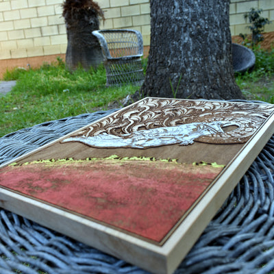 Falling astronaut artwork, celestial hand-painted wooden piece.