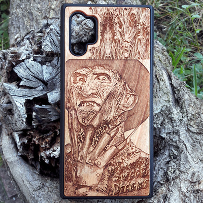 Freddy Krueger wood phone case with a laser-engraved design, showing Freddy's menacing face and "Sweet Dreams" inscription. Compatible with iPhone  and Samsung Galaxy S, the case features a detailed, horror-themed engraving perfect for fans of A Nightmare on Elm Street.
