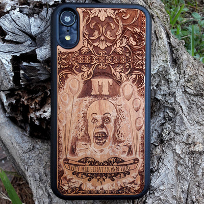 Wooden phone case with Stephen King's It clown design, intricately carved for iPhone , iPhone 15, Galaxy S, S24, Note 20, and more. Ideal for horror fans seeking unique protection and artistic style.