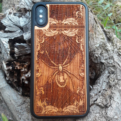 Wooden phone case featuring a detailed Black Widow Spider engraving, handcrafted for iPhone , iPhone 15, Samsung Galaxy S, and more. Perfect for horror and gothic enthusiasts looking for unique, durable phone protection.