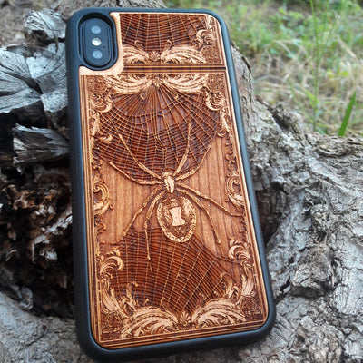 Wooden phone case featuring a detailed Black Widow Spider engraving, handcrafted for iPhone , iPhone 15, Samsung Galaxy S, and more. Perfect for horror and gothic enthusiasts looking for unique, durable phone protection.