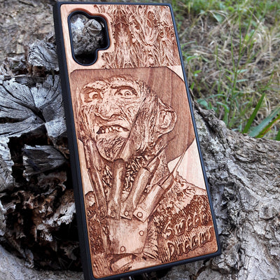 Freddy Krueger wood phone case with a laser-engraved design, showing Freddy's menacing face and "Sweet Dreams" inscription. Compatible with iPhone  and Samsung Galaxy S, the case features a detailed, horror-themed engraving perfect for fans of A Nightmare on Elm Street.