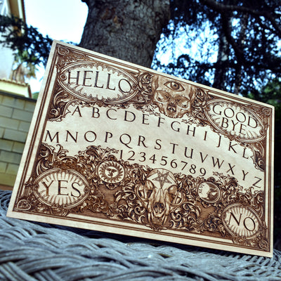 Unique spirit board with mystical engravings on solid wood.