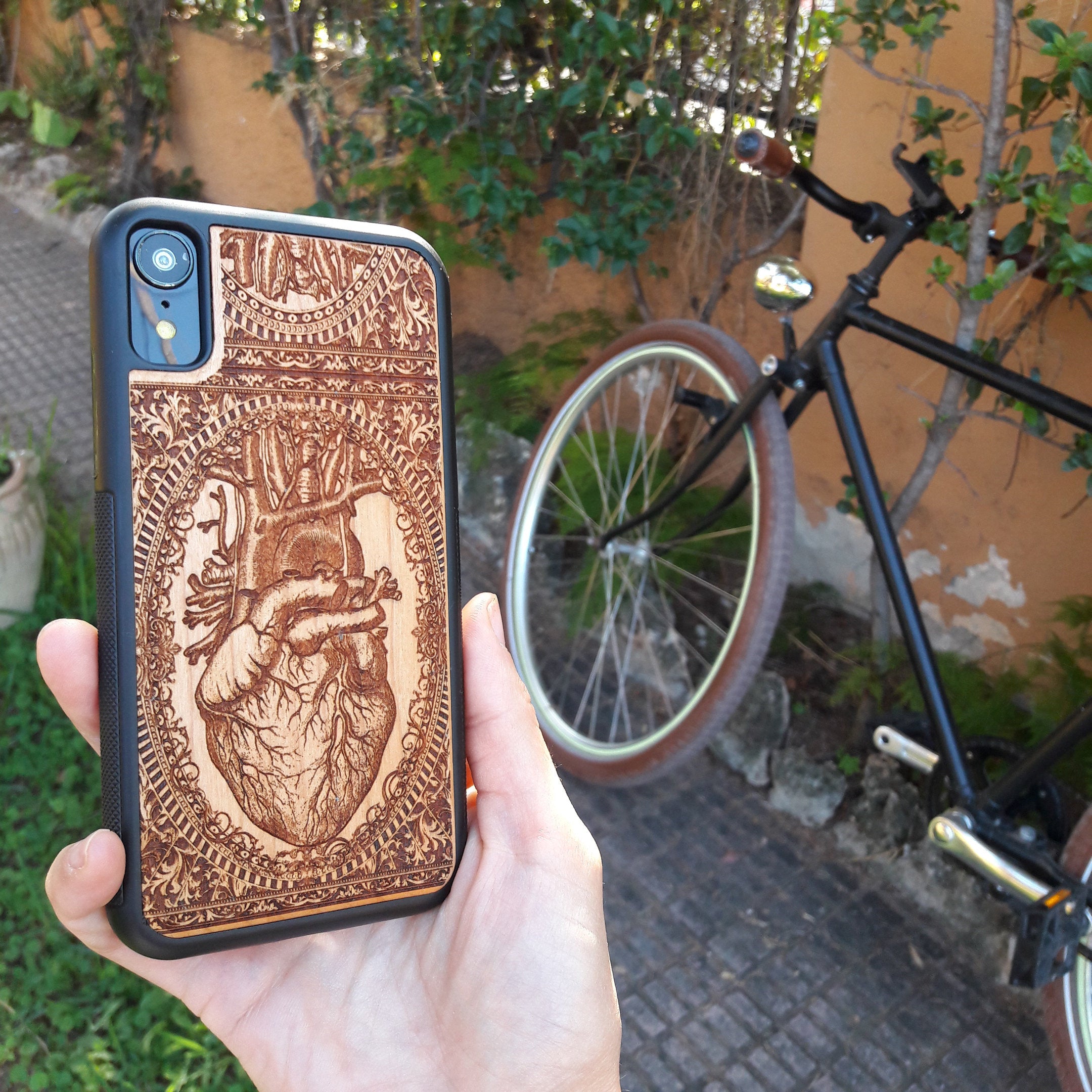 Wooden phone case with an anatomical human heart design, laser-engraved for iPhone 16, Samsung Galaxy S25, and more. Perfect for fans of medical art, anatomy, and unique phone accessories.