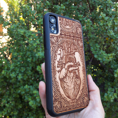 Wooden phone case with an anatomical human heart design, laser-engraved for iPhone 16, Samsung Galaxy S25, and more. Perfect for fans of medical art, anatomy, and unique phone accessories.