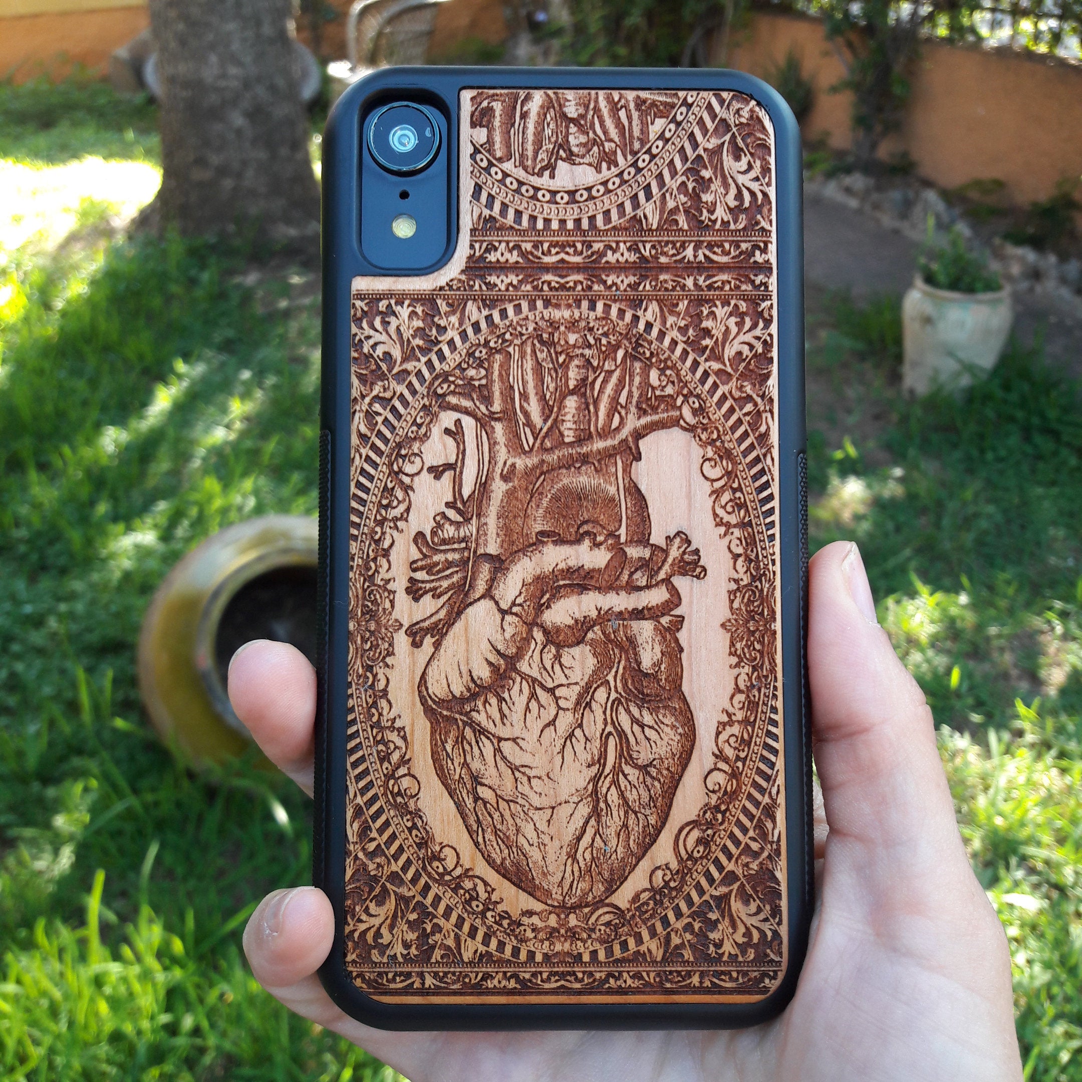 Wooden phone case with an anatomical human heart design, laser-engraved for iPhone 16, Samsung Galaxy S25, and more. Perfect for fans of medical art, anatomy, and unique phone accessories.
