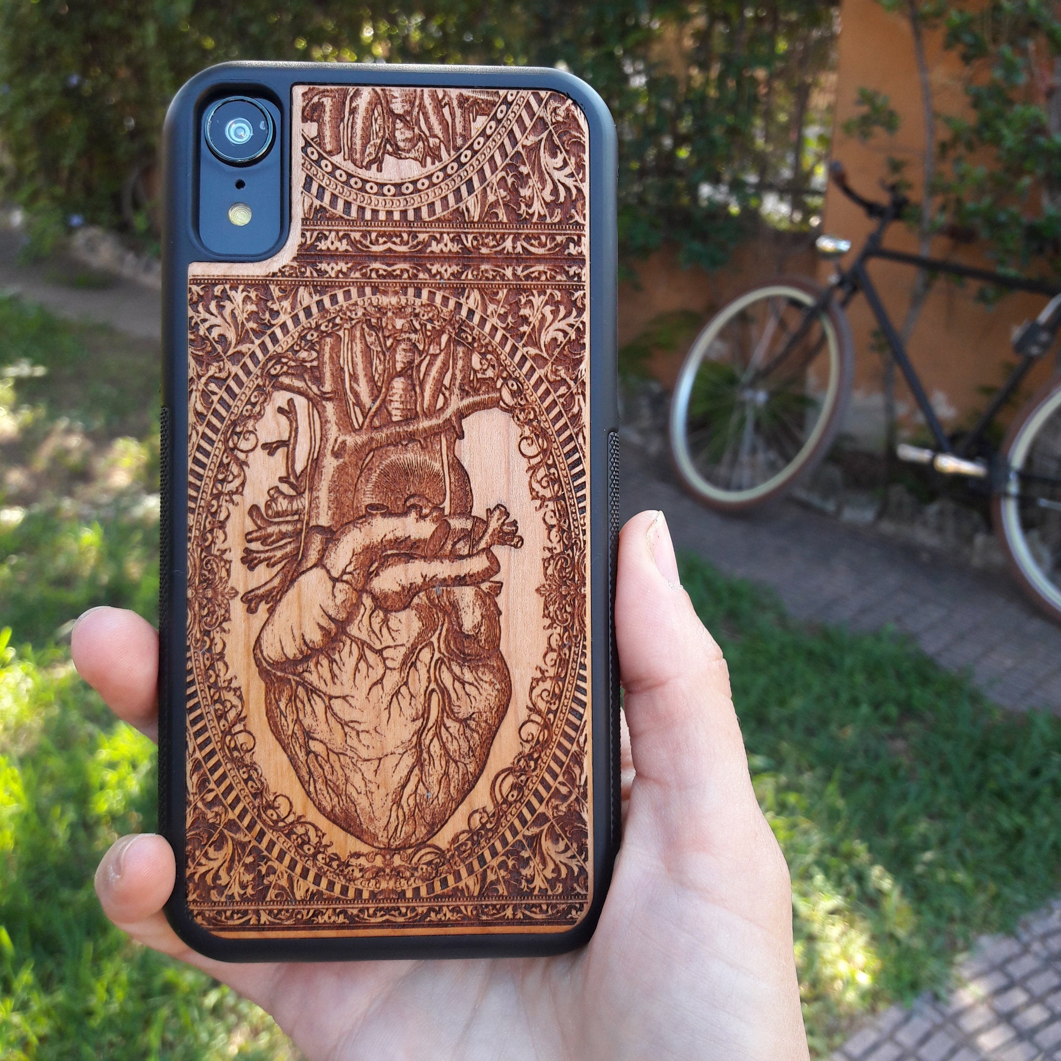 Wooden phone case with an anatomical human heart design, laser-engraved for iPhone 16, Samsung Galaxy S25, and more. Perfect for fans of medical art, anatomy, and unique phone accessories.