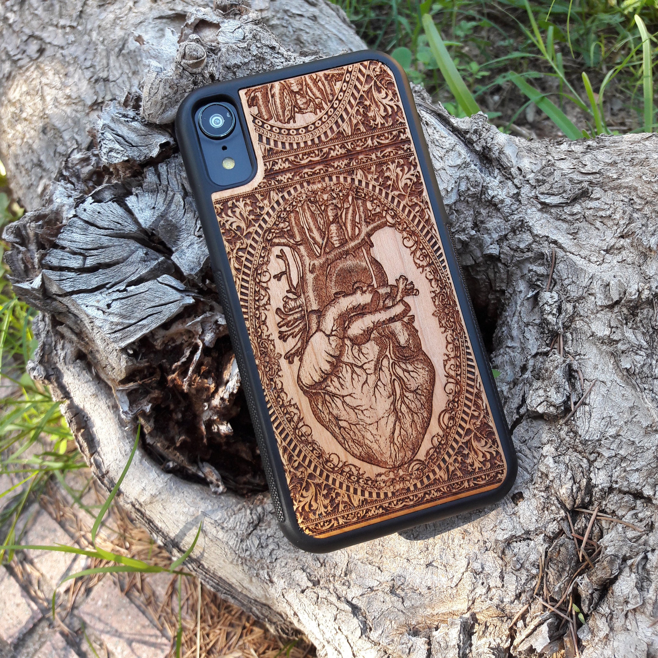 Wooden phone case with an anatomical human heart design, laser-engraved for iPhone 16, Samsung Galaxy S25, and more. Perfect for fans of medical art, anatomy, and unique phone accessories.