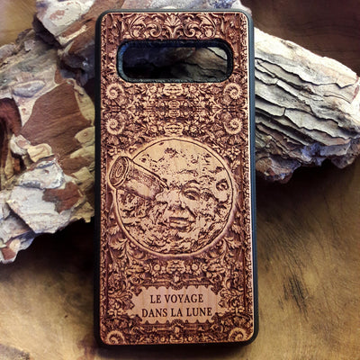 Wooden phone case with detailed laser engraving of 'A Trip to the Moon' design, available for iPhone , iPhone 15, Galaxy S, Note 20, and other models. Perfect for vintage movie fans and space enthusiasts.