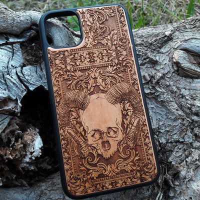 Skull and ram horns laser-engraved wooden phone case for iPhone & Samsung Galaxy – Compatible with iPhone  and Samsung Galaxy S

This optimization focuses on the dark, gothic, and alternative elements of the design, including the skull and ram horns theme, while also highlighting the compatibility with both iPhone and Samsung Galaxy models for better search engine visibility.