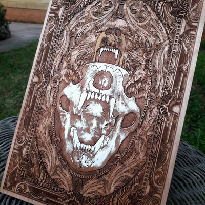 Handcrafted wooden artwork featuring a skull bear in gothic style