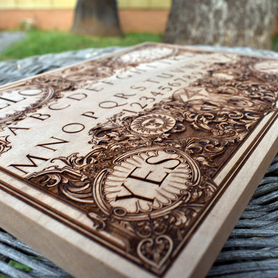 Vintage-style handcrafted Ouija board for spirit communication.