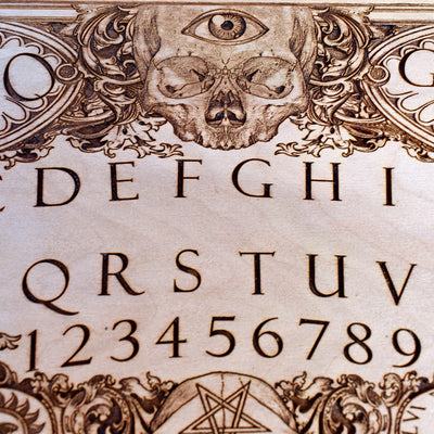Handmade occult spirit board featuring a mystical gothic design.