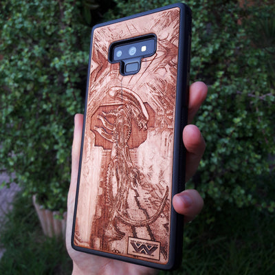 Wooden Xenomorph phone case with intricate HR Giger-inspired design, compatible with iPhone , iPhone 15, Galaxy S, and more. Perfect for Alien movie fans and sci-fi lovers.