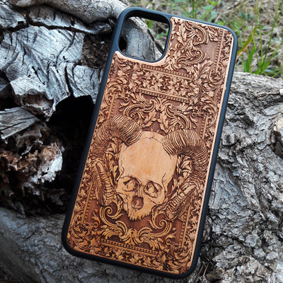 Skull and ram horns laser-engraved wooden phone case for iPhone & Samsung Galaxy – Compatible with iPhone  and Samsung Galaxy S

This optimization focuses on the dark, gothic, and alternative elements of the design, including the skull and ram horns theme, while also highlighting the compatibility with both iPhone and Samsung Galaxy models for better search engine visibility.