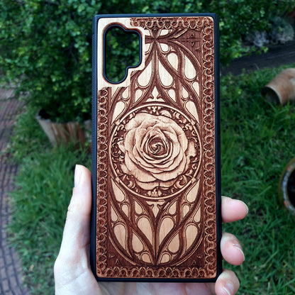 Laser-engraved wooden phone case with intricate rose design, slim, durable, and compatible with iPhone 16, iPhone 15, iPhone 14, iPhone 13, iPhone 12, iPhone 11, iPhone 16 Pro Max, iPhone 16 Mini, Samsung Galaxy S25, Samsung Galaxy S24, Samsung Galaxy S23, Samsung Galaxy S22, Samsung Galaxy S21, Samsung Galaxy S20 Ultra, Samsung Galaxy S20 Plus, and Samsung Galaxy Note 20. Nature-inspired and unique!