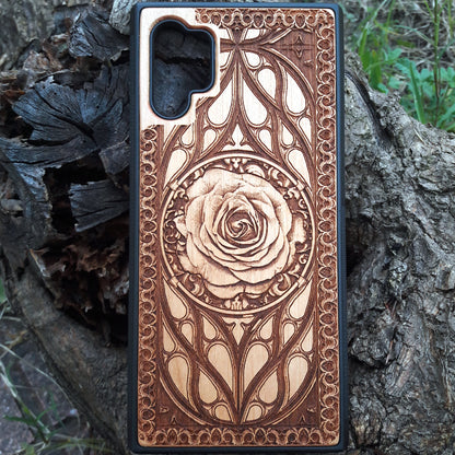 Laser-engraved wooden phone case with intricate rose design, slim, durable, and compatible with iPhone 16, iPhone 15, iPhone 14, iPhone 13, iPhone 12, iPhone 11, iPhone 16 Pro Max, iPhone 16 Mini, Samsung Galaxy S25, Samsung Galaxy S24, Samsung Galaxy S23, Samsung Galaxy S22, Samsung Galaxy S21, Samsung Galaxy S20 Ultra, Samsung Galaxy S20 Plus, and Samsung Galaxy Note 20. Nature-inspired and unique!