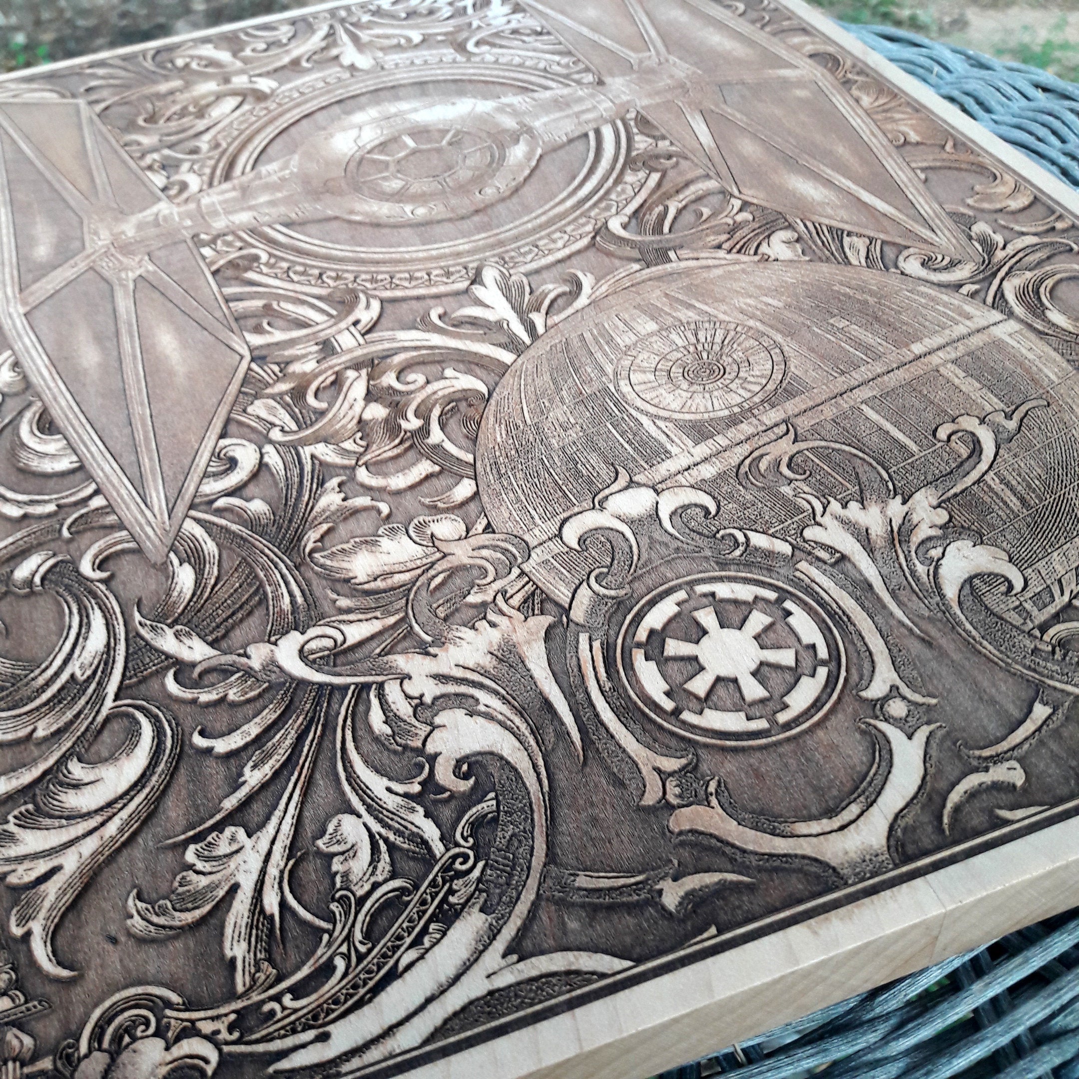 Sci-fi themed TIE Fighter wall decor, laser carved on dark wood.