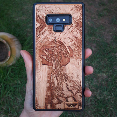 Wooden Xenomorph phone case with intricate HR Giger-inspired design, compatible with iPhone , iPhone 15, Galaxy S, and more. Perfect for Alien movie fans and sci-fi lovers.