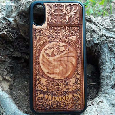 Arrakis Dune-inspired wood phone case featuring the iconic planet and "The Spice Must Flow" phrase, compatible with iPhone , 15, 14, 13, 12, 11 Pro Max Mini, Samsung Galaxy S, S24, S23, S22, S21, S20 Ultra Plus, and Note 20. Unique laser-engraved design