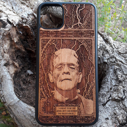 Wooden phone case with intricate carving of Frankenstein’s face and a classic quote: ‘I ought to be thy Adam, but I am rather the fallen angel...’ Designed for iPhone 16, Samsung Galaxy S25. Perfect for classic horror fans and vintage collectors.