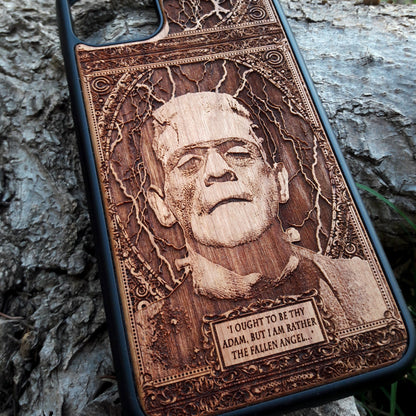 Wooden phone case with intricate carving of Frankenstein’s face and a classic quote: ‘I ought to be thy Adam, but I am rather the fallen angel...’ Designed for iPhone 16, Samsung Galaxy S25. Perfect for classic horror fans and vintage collectors.