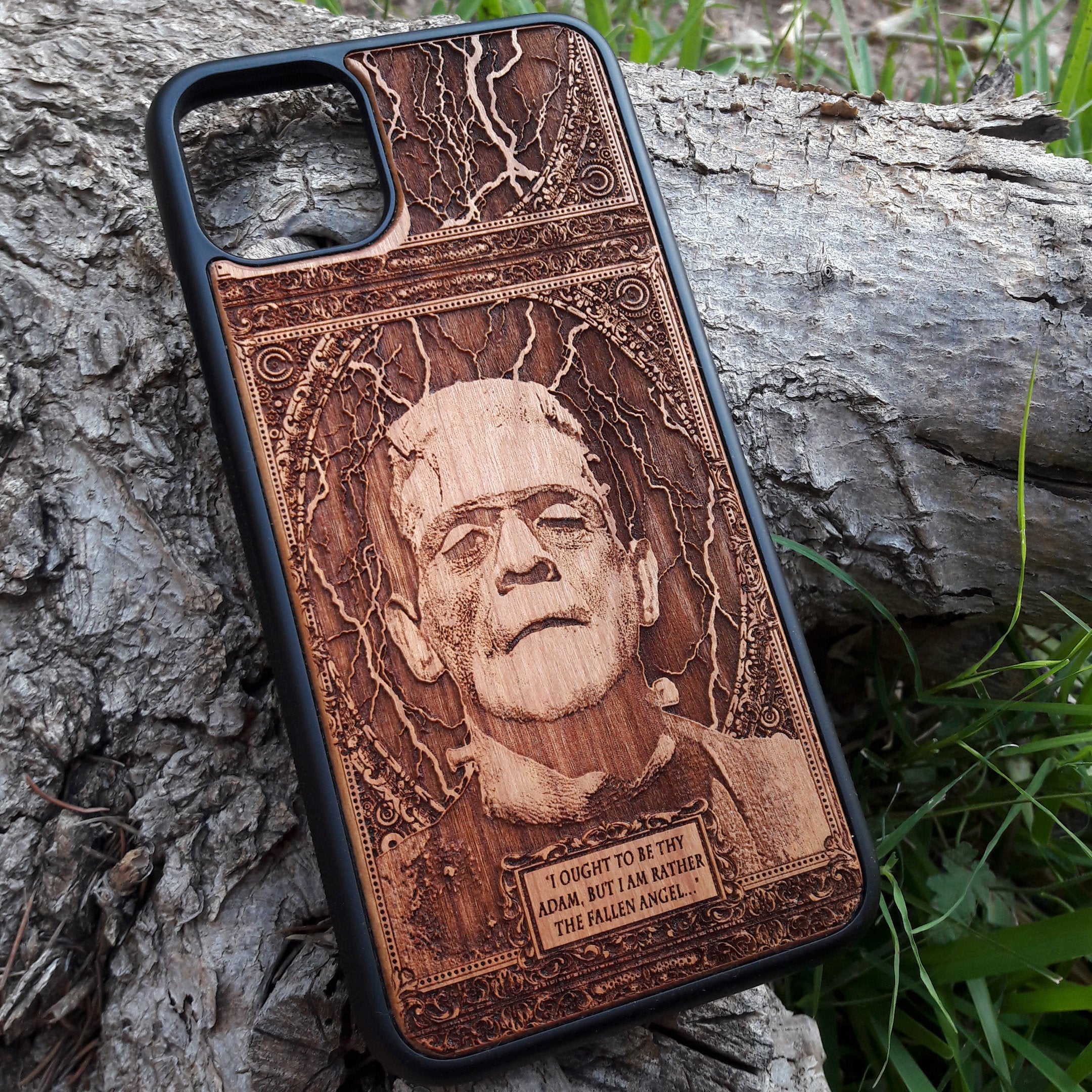 Wooden phone case with intricate carving of Frankenstein’s face and a classic quote: ‘I ought to be thy Adam, but I am rather the fallen angel...’ Designed for iPhone 16, Samsung Galaxy S25. Perfect for classic horror fans and vintage collectors.