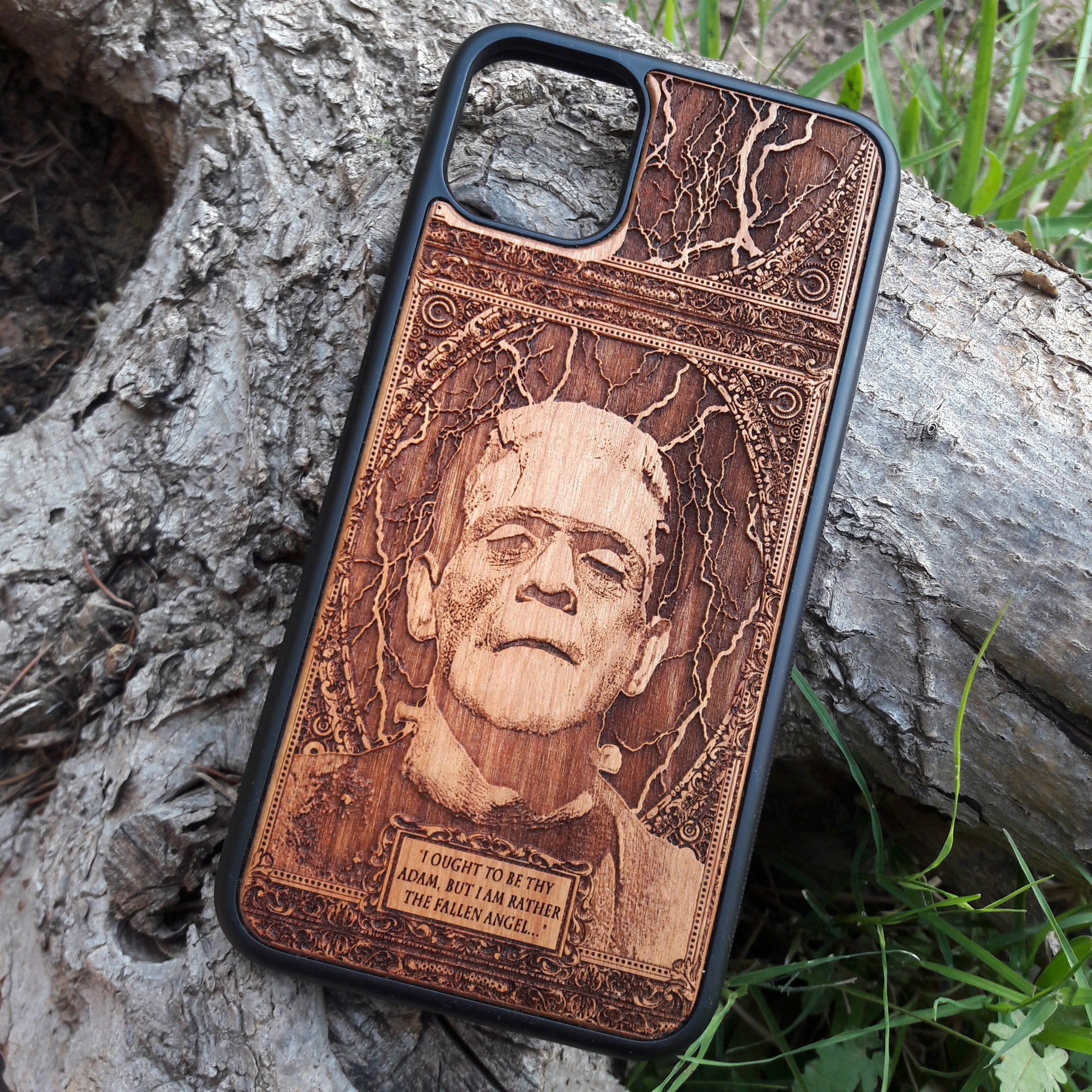 Wooden phone case with intricate carving of Frankenstein’s face and a classic quote: ‘I ought to be thy Adam, but I am rather the fallen angel...’ Designed for iPhone 16, Samsung Galaxy S25. Perfect for classic horror fans and vintage collectors.