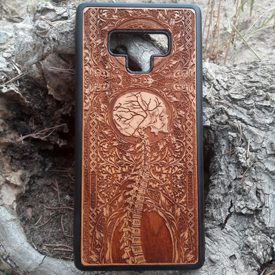 Wooden Spine phone case featuring detailed gothic carvings, compatible with iPhone , iPhone 15, Samsung Galaxy S, Note 20, and more. Ideal for lovers of gothic art and unique phone accessories.