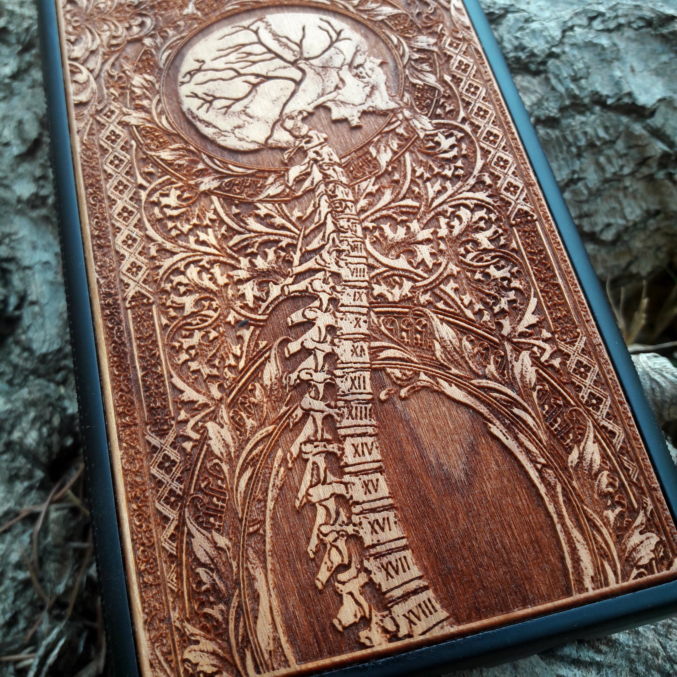 Wooden Spine phone case featuring detailed gothic carvings, compatible with iPhone 16, iPhone 15, Samsung Galaxy S25, Note 20, and more. Ideal for lovers of gothic art and unique phone accessories.