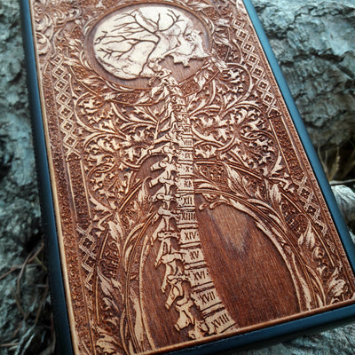 Wooden Spine phone case featuring detailed gothic carvings, compatible with iPhone , iPhone 15, Samsung Galaxy S, Note 20, and more. Ideal for lovers of gothic art and unique phone accessories.