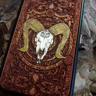 Ram skull wooden phone case with a pentagram, hand-painted and laser-engraved on cherrywood. Compatible with iPhone -11 Pro Max, Galaxy S-S20. Gothic and occult-inspired phone case.