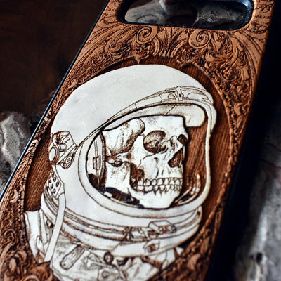 Laser-engraved "Inner Space" design featuring a surreal cosmic scene on a wooden phone case, compatible with iPhone 16, iPhone 15, Galaxy S25, and more.
