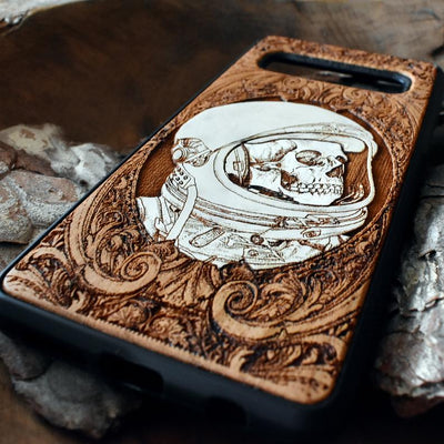 Laser-engraved "Inner Space" design featuring a surreal cosmic scene on a wooden phone case, compatible with iPhone 16, iPhone 15, Galaxy S25, and more.