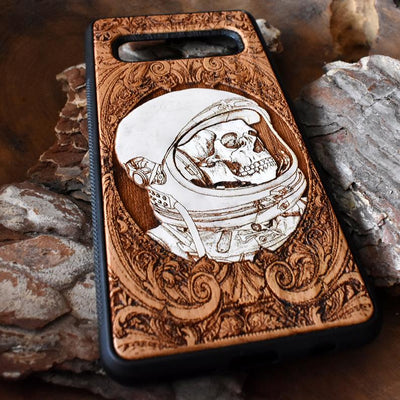 Laser-engraved "Inner Space" design featuring a surreal cosmic scene on a wooden phone case, compatible with iPhone 16, iPhone 15, Galaxy S25, and more.