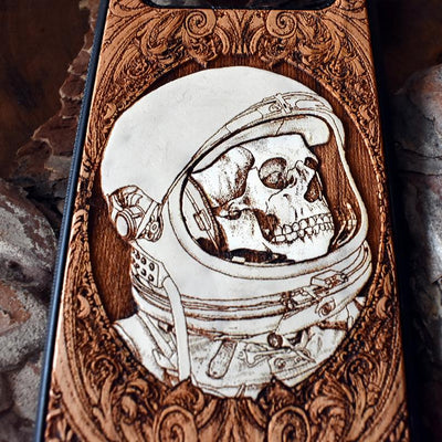 Laser-engraved "Inner Space" design featuring a surreal cosmic scene on a wooden phone case, compatible with iPhone 16, iPhone 15, Galaxy S25, and more.