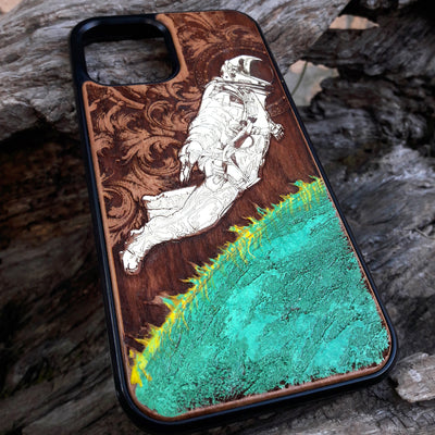 Hand-finished cherry wood phone case featuring a detailed Green Planet engraving, designed for iPhone & Samsung Galaxy.