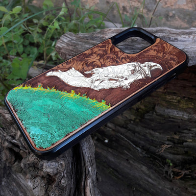 Hand-painted cherry wood phone case with vibrant green planet design.