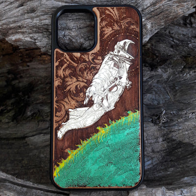 Hand-painted cherry wood phone case with vibrant green planet design.