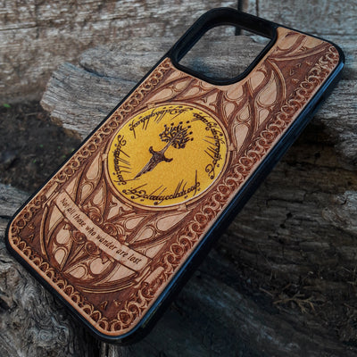 Lord of the Rings wood phone case featuring a stunning laser-engraved Tolkien design with intricate Elvish script and detailed patterns. Compatible with iPhone , iPhone 15, 14, 13, 12, 11 Pro Max Mini, and Samsung Galaxy S, S24, S23, S22, S21, S20 Ultra, Plus, Note 20. Durable, slim, and stylish, perfect for fans of Tolkien's Middle-Earth looking for a unique phone case.