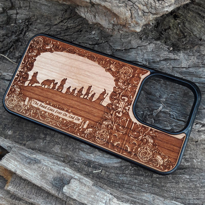 Lord of the Rings wood phone case featuring the Fellowship of the Ring silhouette, ornate border designs, and the engraved quote 'The Road Goes Ever On And On.' Laser-engraved for intricate detailing and crafted for durability, this case is compatible with iPhone , 15, 14, 13, 12, 11, Pro Max, Mini, and Samsung Galaxy S, S24, S23, S22, S21, S20 Ultra, Plus, Note 20. A perfect accessory for Tolkien fans seeking style and protection.