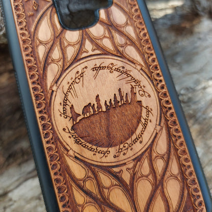 Lord of the Rings wood phone case featuring the Fellowship of the Ring silhouette surrounded by Elvish script and intricate, elegant patterns. Laser-engraved for precision and durability, this case is compatible with iPhone 16, 15, 14, 13, 12, 11, Pro Max, Mini, and Samsung Galaxy S25, S24, S23, S22, S21, S20 Ultra, Plus, Note 20. A unique and protective accessory for Tolkien fans.