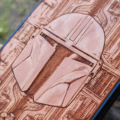 Star Wars Mandalorian helmet wood phone case, laser-engraved design featuring the iconic Mandalorian helmet, offering a unique, stylish look for iPhone , Samsung Galaxy S, and other models. Durable, slim, and perfect for Star Wars fans.