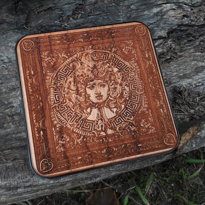 Artisan wood wireless charger with Greek mythology Medusa theme.