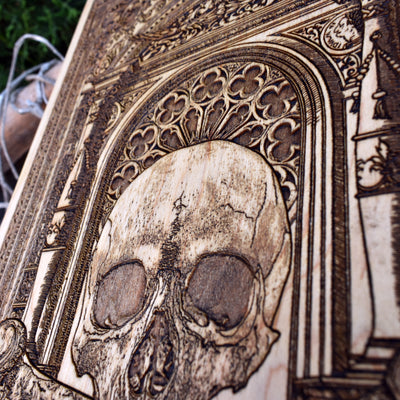 Dark aesthetic skull artwork on wood, ideal for gothic spaces