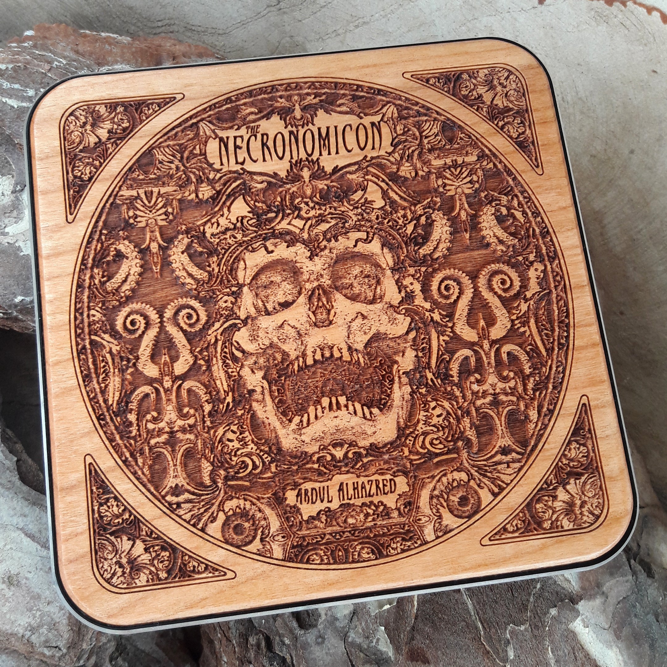 Dark art wireless charger featuring Necronomicon symbols.