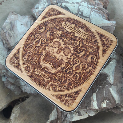 Close-up of ancient runes from the Necronomicon on wood charger.